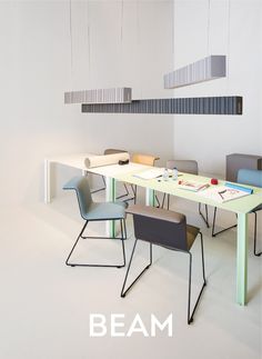 a table with four chairs around it and the words beam hanging from the ceiling above