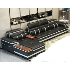 a modern living room with black leather furniture