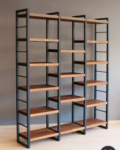 the shelves are made out of metal and wood, with wooden shelves on each side