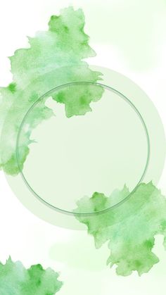 a circular frame with green watercolor paint on it