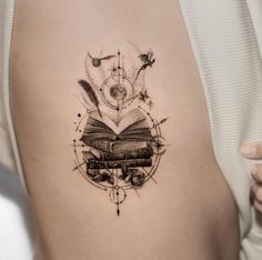 a woman with a book tattoo on her stomach