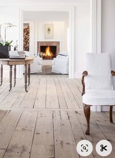 a living room filled with furniture and a fire place