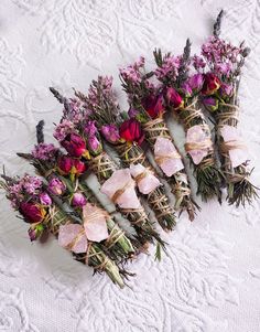 dried flowers laid out on a white tablecloth