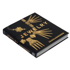 a book with two golden forks on it's cover and the title jewelry written in gold