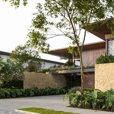 the house is surrounded by greenery and trees