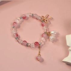 Lily Flower Bow Pendant Beaded Hand String - Sweet And Trendy Pink Gradient Jewelry Gift For Girls Elegant Flower Crystal Bracelet For Spring, Elegant Flower Shaped Crystal Bracelet For Spring, Spring Crystal Bracelet With Round Beads As Gift, Pink Casual Beaded Bracelets For Spring, Pink Flower Crystal Bracelet With Colorful Beads, Casual Pink Beaded Crystal Bracelet, Pink Beaded Flower Crystal Bracelet, Pink Flower-shaped Beaded Crystal Bracelet, Casual Pink Crystal Bracelet With Colorful Beads