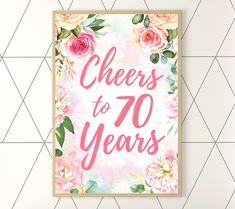 a poster with the words cheers to 90 years in pink and green flowers on it