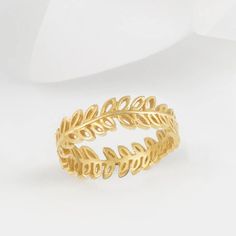 Flor 18 Carat Gold Plated Olive Leaf Ring.The rustic, hand-forged olive vine leaves that make up this 18 Carat Gold Plated eternity band, ring wrap all the way around the finger. The silver has an organic, molten texture which makes for a lovely everyday ring which can be worn independently or stacked with other rings from the Lucie Locket Stacking range.Individually handmade by Lucie Locket specialist artisans each ring holds it's own unique soul and personality and may slightly vary from the i Eternity Rings Stackable, Olive Leaf Ring, Ring Wrap, Locket Ring, Sweet Ring, Rose Gold Morganite, Rose Gold Quartz, Vine Leaves, Everyday Ring