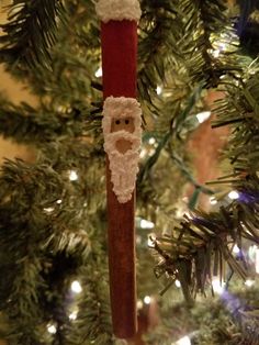 a christmas ornament hanging from a tree