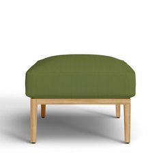 a green ottoman with wooden legs on an isolated white background in the style of minimalism