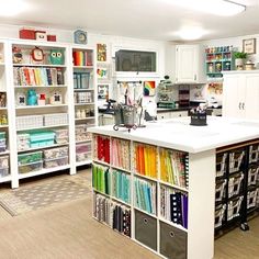 an organized craft room with lots of storage