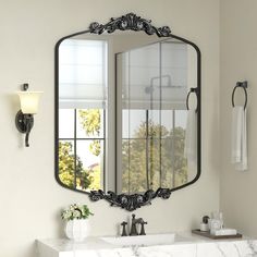 a bathroom sink with a large mirror above it