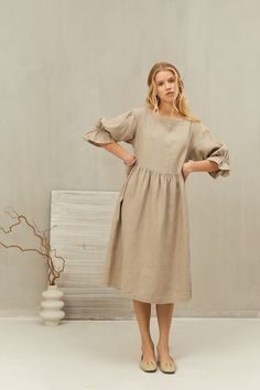 This smock dress is perfect for all occasions and seasons.   Made from natural linen with a loose oversized fit and slightly puffed sleeves, it will add a touch of simple elegance to your look. The dress is perfect for casual autumn days, office, summer holiday adventures, beach wear and birthday, anniversary and wedding celebrations. It is also perfect for pregnancy time. Celebrate the femininity with sustainable LGlinen creations ITEM DETAILS: - Loose straight shape - Long sleeves - Two sides Linen Ruffle Dress For Daywear, Linen Daywear Dress With Ruffles, Linen Ruffle Dress For Brunch, Knee-length Ruffled Linen Dress For Spring, Spring Linen Dress With Gathered Sleeves, Knee-length Linen Midi Dress With Ruffles, Beige Linen Dress With Ruffles For Spring, Spring Beige Linen Dress With Ruffles, Casual Linen Dress With Gathered Sleeves