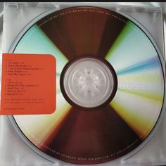 a cd with an orange label on it