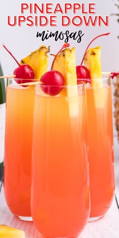 pineapple upside down drinks in glasses with cherries on the rim and pineapple