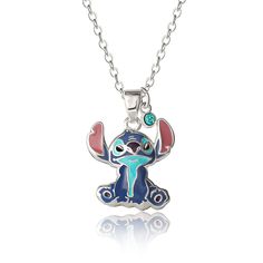 a small blue and red necklace with an elephant on it's back, sitting in front of a white background