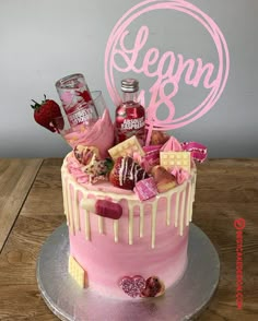 a birthday cake decorated with liquor and sweets