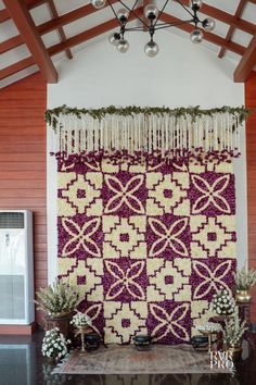 the wall is decorated with purple and white flowers