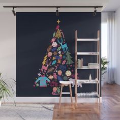 a christmas tree decorated with cartoon characters and stars on it wall mural print in a living room