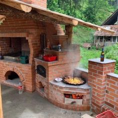 an outdoor brick pizza oven with lots of food cooking on it