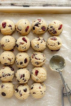 a baking sheet with cookies and spoons on it