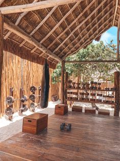 the inside of a hut with wooden floors and walls