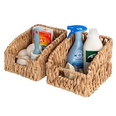 two wicker baskets with bottles and soaps in them on a white background,