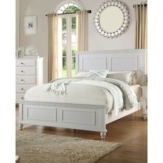 a white bed sitting in a bedroom next to a dresser and mirror on top of a wooden floor