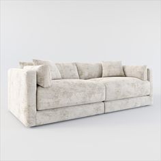 a white couch with pillows sitting on it's back end and the seat up