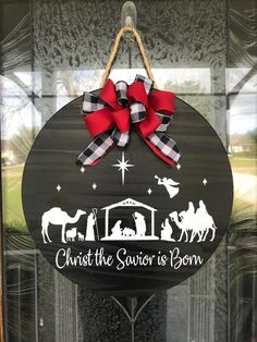 a christmas door hanger that says christ the savor is born with nativity