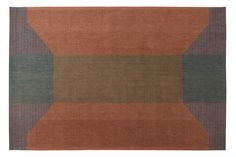 an orange, green and brown rug with squares on the bottom half is shown in front of a white background