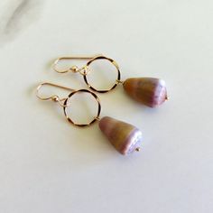 Hawaiian Cone Shell Earrings~ Pretty cone shells dangle from 14k gold fill textured hoops.  Hoops .5" SHOP~ https://www.etsy.com/shop/HanaMauiCreations?ref=si_shop International buyers please read our shipping policies before ordering~ POLICIES~ https://www.etsy.com/shop/HanaMauiCreations/policy?ref=shopinfo_policies_leftnav Shell Hoop Earrings, Earrings Pretty, Cone Shell, Island Fashion, Mermaid Earrings, Hawaii Beach, Hoop Earrings Gold, Shell Earrings, Gold Texture