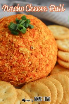 a cheese ball sitting on top of crackers