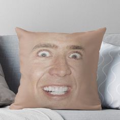 a man's face is shown on the back of a couch with his eyes wide open