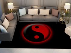 a living room with couches, chairs and a rug in the shape of a yin symbol