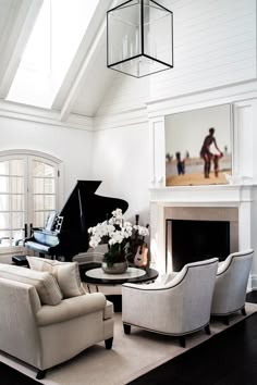 a living room filled with furniture and a piano in the middle of it's walls