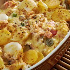 a casserole dish with potatoes, meat and vegetables