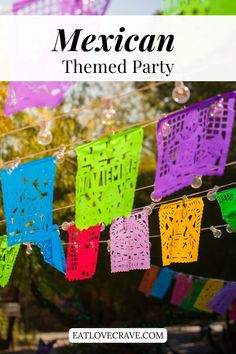 mexican themed party with colorful paper cutouts hanging from clothes line and text overlay