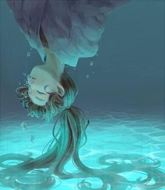 a woman floating in the ocean with her head above water