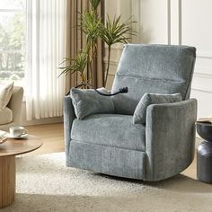 a living room with a chair, coffee table and potted plant