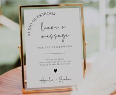 a close up of a sign on a table with a wedding date written on it