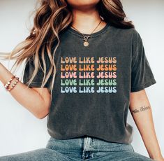 Love Like Jesus Shirt, Colorful Jesus Shirt, Christian T-Shirt, Religious Gifts, Bible Verse Shirt, Motivational Christian Shirt, Jesus Tee Modern classic fit High stitch density for smoother printing surface Non-topstitched, narrow width, rib collar Taped neck and shoulders Double-needle sleeve and bottom hems Tear away label Size & Colors: For size and color options, please refer to the listing images. Usually runs true size. DTF (Direct to Film) printing method is used. It transfers prints onto fabric using a heat-press mechanism.   Care Instructions: Turn the shirt inside out. Machine wash cold with mild detergent. Tumble dry very low. Do not use bleach. Do not iron directly on design. Our garments are pre-shrunk during the garment dye and wash processes for almost no shrinkage at home Jesus Gifts, Love Like Jesus, Church Shirt, Christian Gifts For Women, Jesus Tees, Bible Verse Shirt, Jesus Shirt, Jesus Tshirts, Christian T Shirt