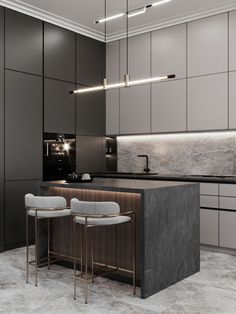 a modern kitchen with marble counter tops and bar stools