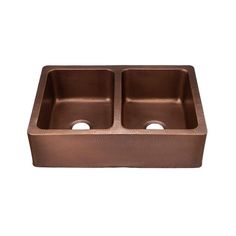 copper double bowl kitchen sink with two faucets in the center and one side