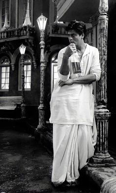 black and white photograph of a woman drinking from a cup