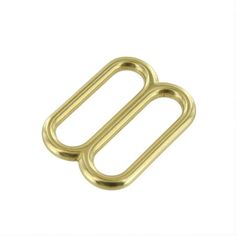 a gold metal buckle with two loops on it's side and one loop in the middle