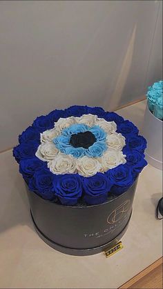 a large blue and white box with roses in it