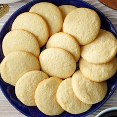 a blue plate filled with cookies on top of a table