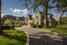 a large house with lots of windows and trees