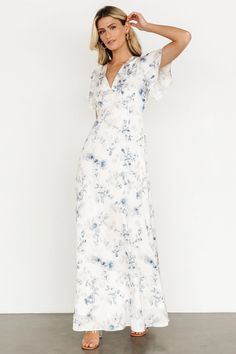 Look and feel beautiful with our Carmen Maxi Dress in Off White + Blue Floral. The romantic style and dainty floral print of this dress make it a perfect pick for your next event. White Dress With Blue Flowers, Church Clothes, Floral Bridesmaid Dresses, White Floral Maxi Dress, Banquet Dresses, Sundress Dress, Baltic Born, Velvet Maxi Dress, Velvet Maxi